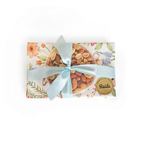 1/2 lb assorted chocolates and 1/4 lb fancy mixed nuts, all wrapped for the Easter holiday.