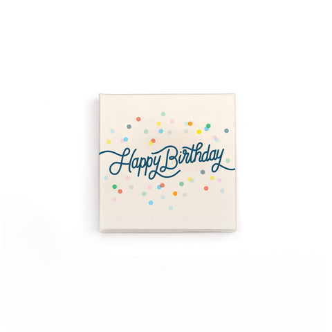The small happy birthday box comes in a cream box with cursive happy birthday type and decorated with confetti.