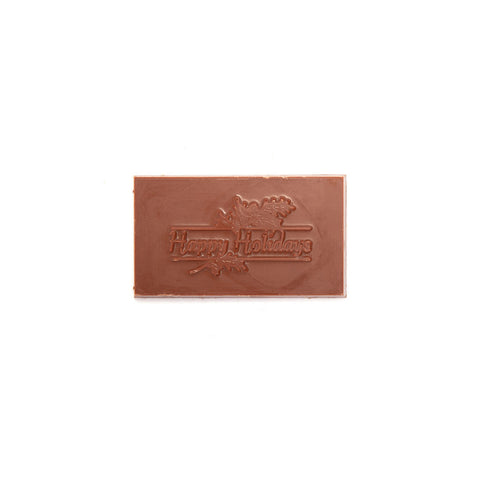 A small milk chocolate bar that says happy holidays