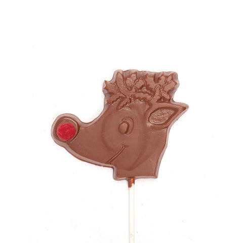 A reindeer head chocolate mold on a stick. with a red berry for a nose