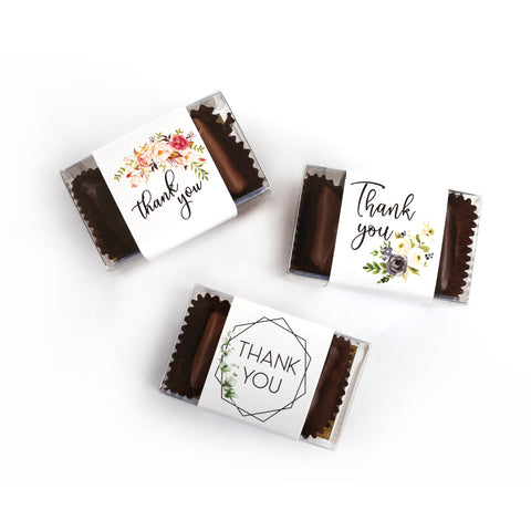 Photo of different band options. A pink floral thank you in black script font. Another thank you band with black script font and white and purple flowers. Last a geometric decorative box with thank you in uppercase letters