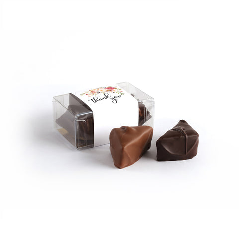 Product photo of two chocolate clear box truffle