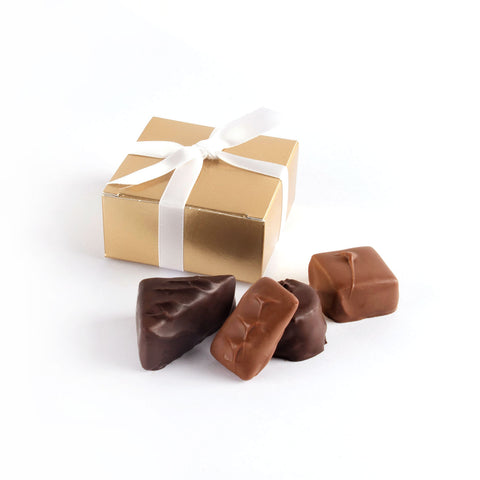Product photo of square box that fits 4 chocolates with satin bow