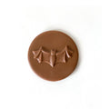 A milk chocolate bat on a moon.