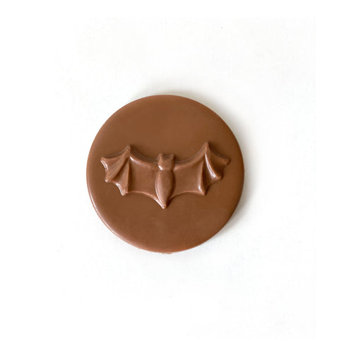 A milk chocolate bat on a moon.
