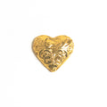 A milk chocolate heart wrapped in gold foil.