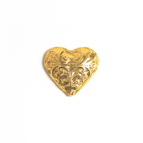 A milk chocolate heart wrapped in gold foil.