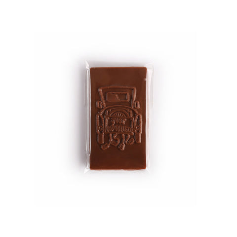 Product photo of just married bar. Chocolate molding is of the back of a car.