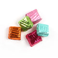 Product photo of square mint patties in a variety of coloured foils