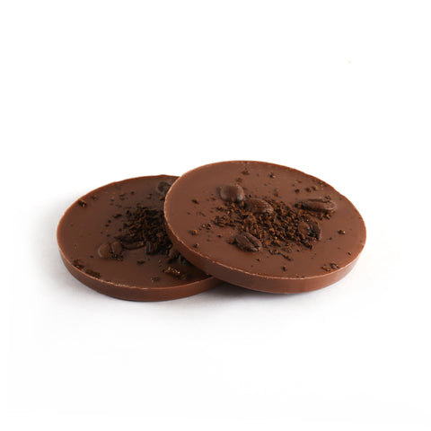 Product photo of dark chocolate mocha delight. Round patty topped with whole coffee beans