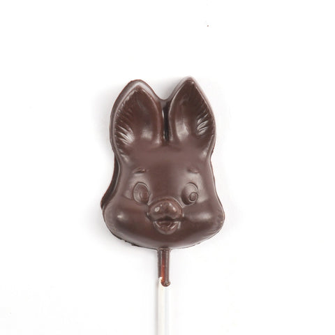 A chocolate bunny face on a stick.