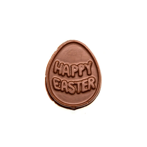 Solid chocolate molding in an egg shape with happy easter written on top.