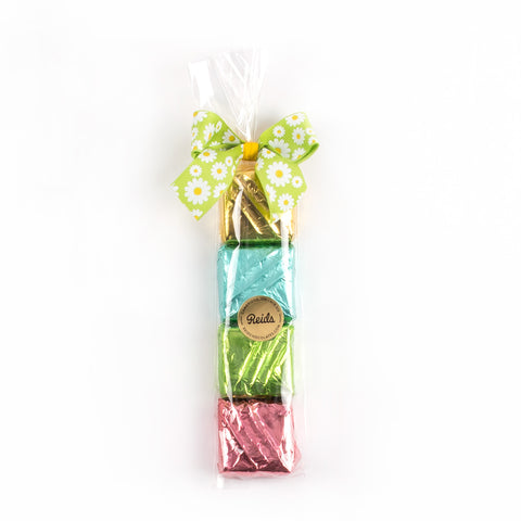 4 chocolate mint square wrapped in Easter foil and tied with a bow.