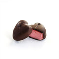 A strawberry cream centre covered in milk and dark chocolate.