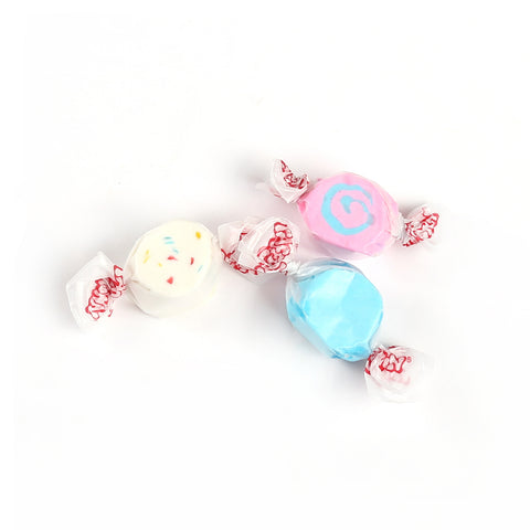 Product photo of saltwater taffy. An assortment of bright coloured taffy