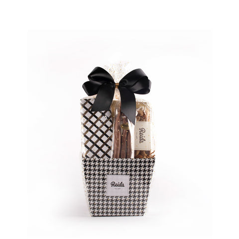 The small basket comes in a black and white houndstooth basket. Wrapped cellophane and tied with a black stain bow.