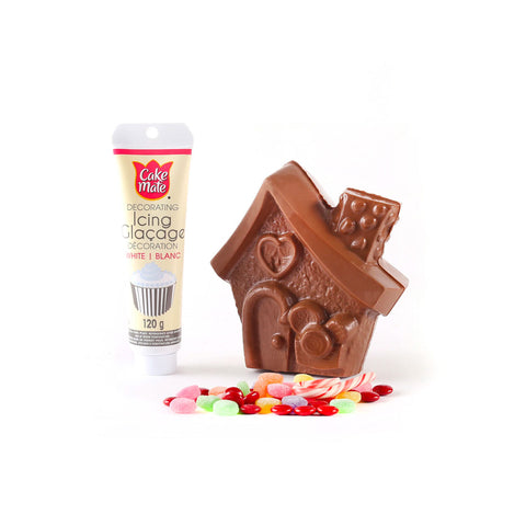 Milk chocolate with icing and assorted candy.