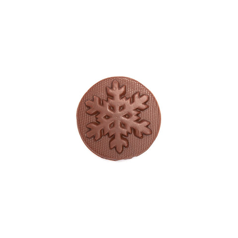 Product photo of milk chocolate snowflake mold. A round disk of chocolate with a snowflake.